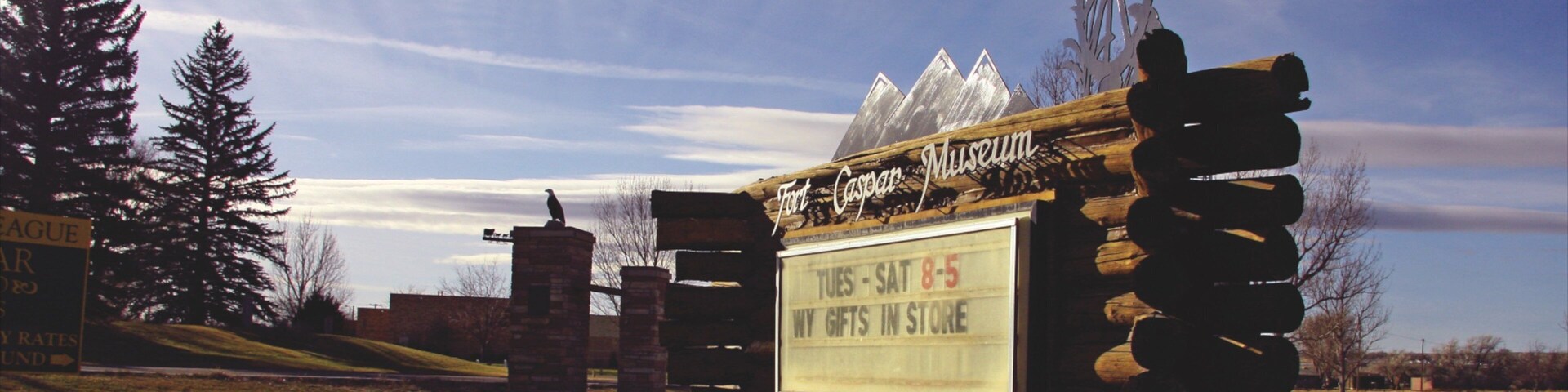 Casper showing tranquil scenes, a sunset and signage