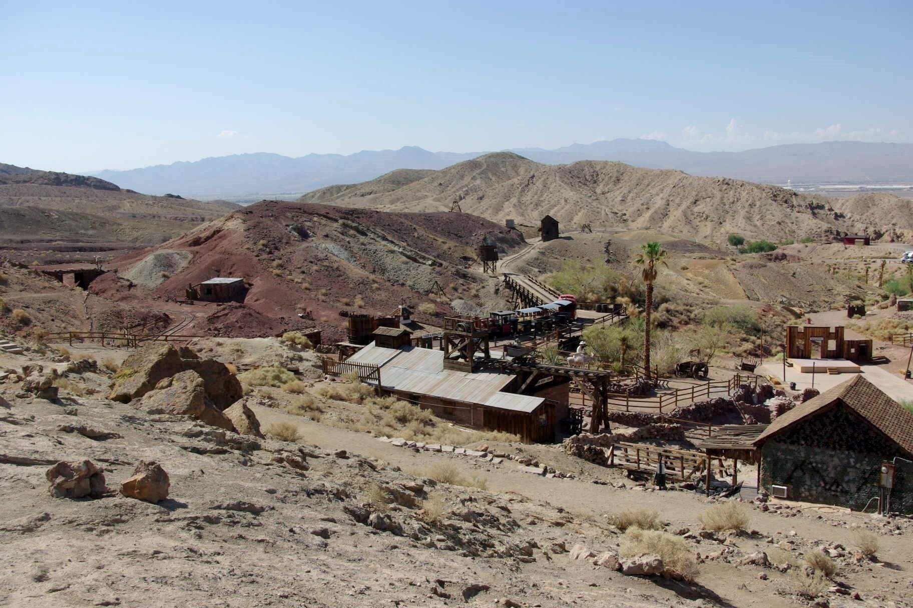 Calico is a ghost town and former mining town in San Bernardino County, California, United States. Located in the Calico Mountains of the Mojave Desert region of Southern California, it was founded in 1881 as a silver mining town, and today has been converted into a county park named Calico Ghost Town. Located off Interstate 15, it lies 3 miles (4.8 km) from Barstow and 3 miles from Yermo. Giant letters spelling CALICO can be seen on the Calico Peaks behind the ghost town from the freeway. Walter Knott purchased Calico in the 1950s, architecturally restoring all but the five remaining original buildings to look as they did in the 1880s. Calico received California Historical Landmark