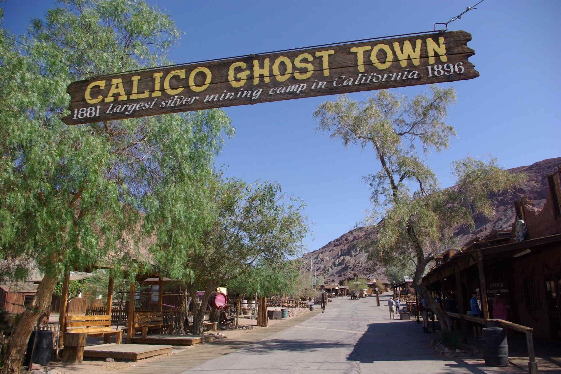 Calico is a ghost town and former mining town in San Bernardino County, California, United States. Located in the Calico Mountains of the Mojave Desert region of Southern California, it was founded in 1881 as a silver mining town, and today has been converted into a county park named Calico Ghost Town. Located off Interstate 15, it lies 3 miles (4.8 km) from Barstow and 3 miles from Yermo. Giant letters spelling CALICO can be seen on the Calico Peaks behind the ghost town from the freeway. Walter Knott purchased Calico in the 1950s, architecturally restoring all but the five remaining original buildings to look as they did in the 1880s. Calico received California Historical Landmark
