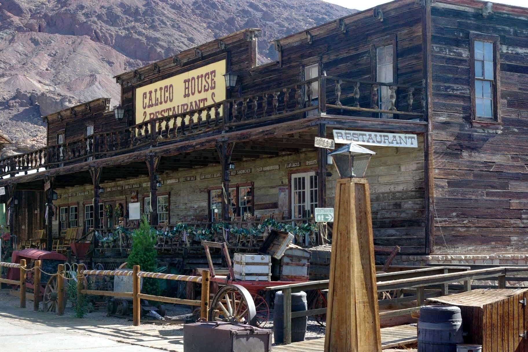Calico is a ghost town and former mining town in San Bernardino County, California, United States. Located in the Calico Mountains of the Mojave Desert region of Southern California, it was founded in 1881 as a silver mining town, and today has been converted into a county park named Calico Ghost Town. Located off Interstate 15, it lies 3 miles (4.8 km) from Barstow and 3 miles from Yermo. Giant letters spelling CALICO can be seen on the Calico Peaks behind the ghost town from the freeway. Walter Knott purchased Calico in the 1950s, architecturally restoring all but the five remaining original buildings to look as they did in the 1880s. Calico received California Historical Landmark