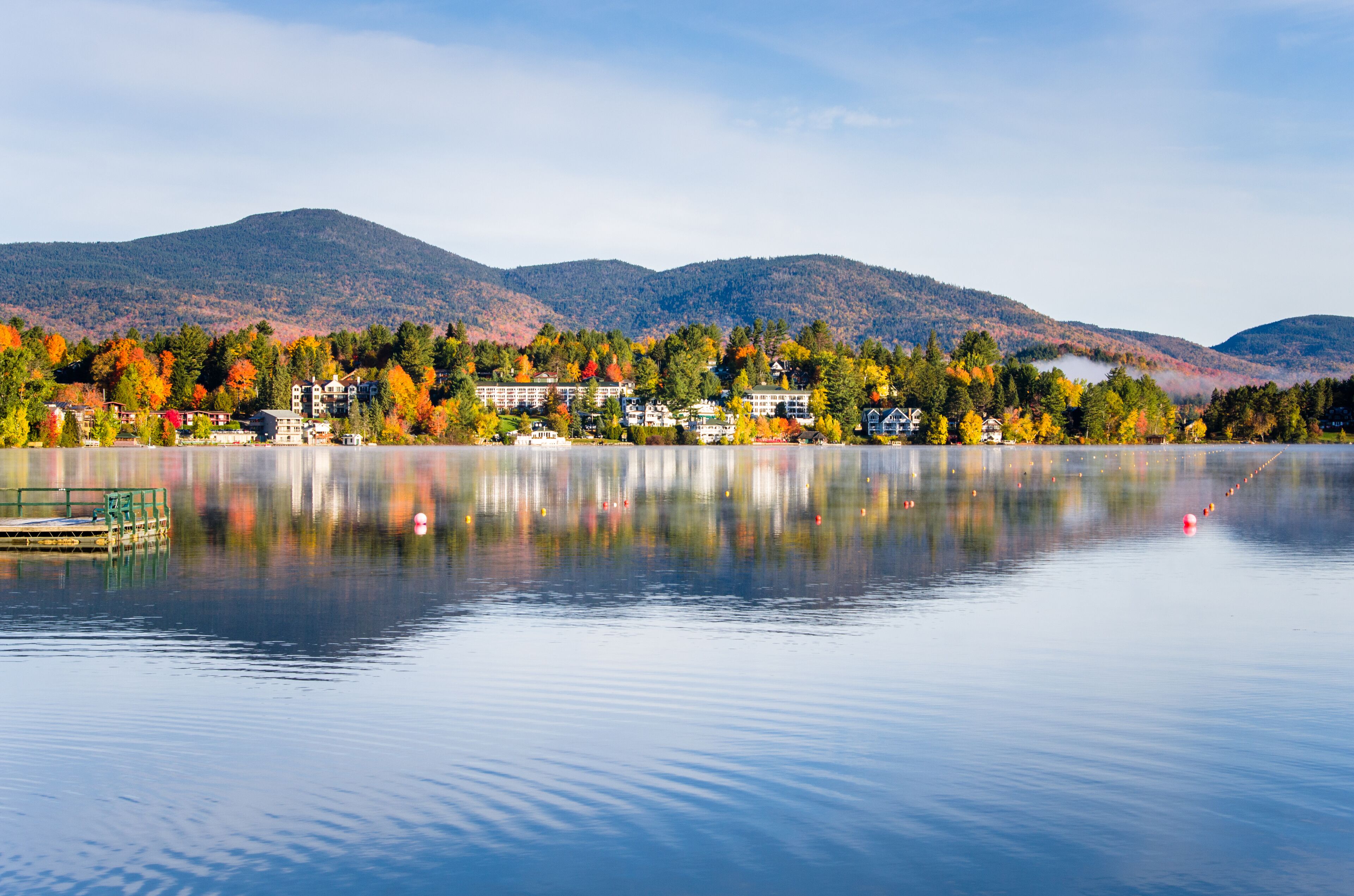 View of the Mountain Village of Lake Placid from a Foggy Mirror Lake at Sunrise, Shutterstock ID 682245157, Purchase Order: SP-1891 Wave 0, Client/Licensee: Hotels.com