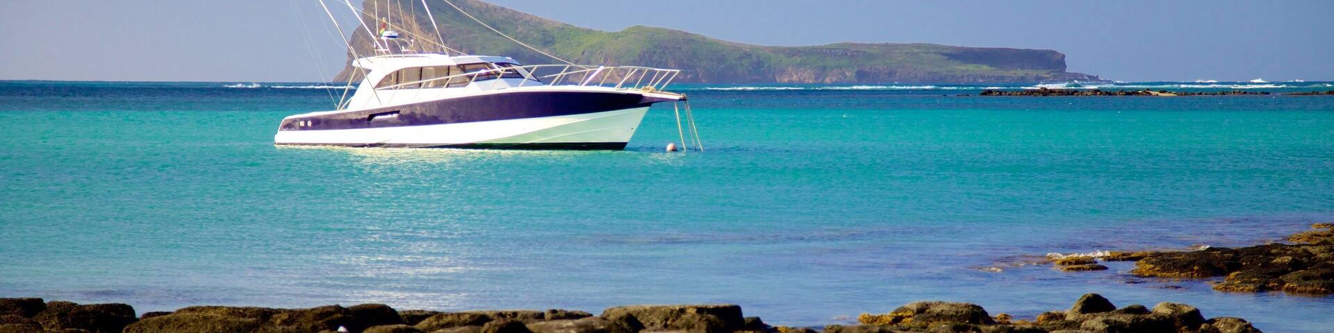 Cap Malheureux which includes boating and rocky coastline