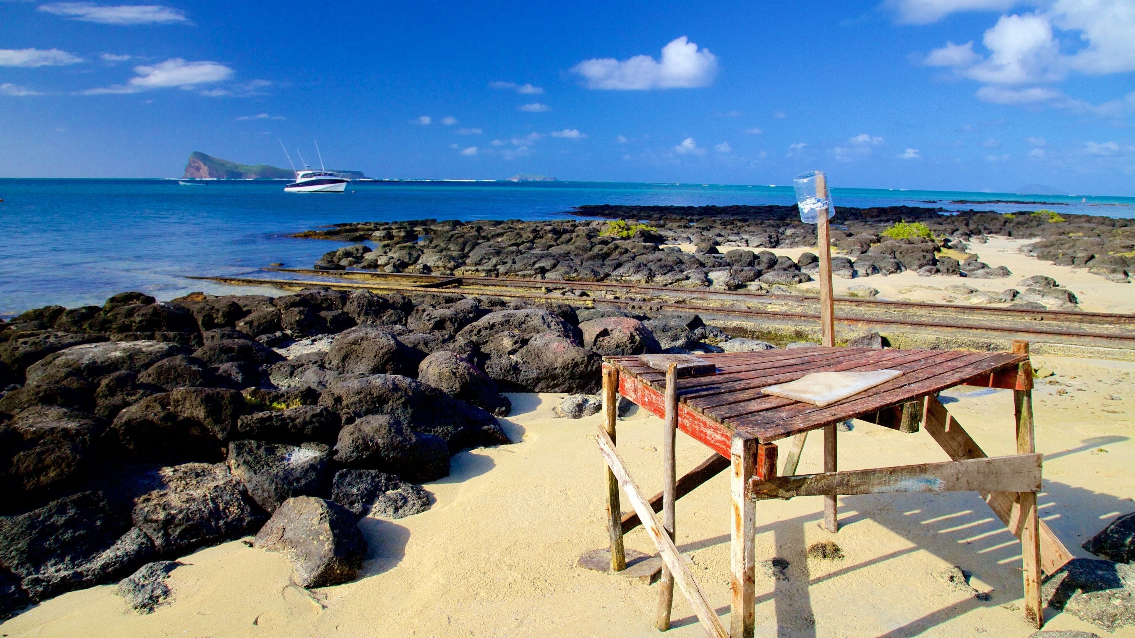 Cap Malheureux which includes rocky coastline and general coastal views
