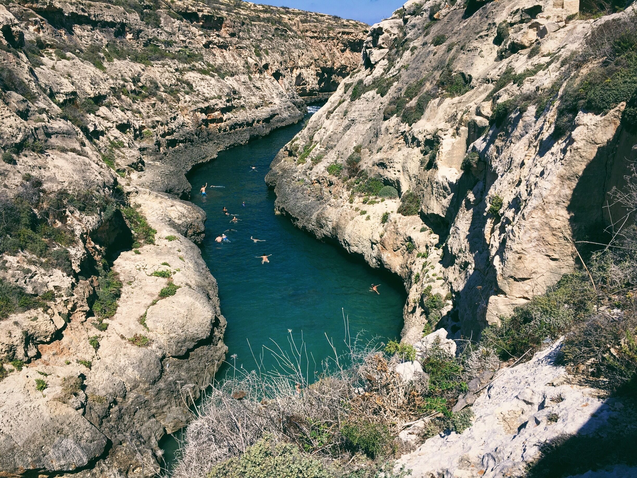 How to get here by by bus/foot:

From Victoria bus station, ride the bus going to Marsalforn.

Alight at the stop near the bay, direction going to Xwejni Bay.

Follow the path going to the salt pans.

Walk/Run.

Take pictures.

Breathe.

Walk/Run some more.

After passing Xwejni Bay and the salt pans, you will see a paved, winding road going up. You will also see a small store selling sea salts. From here, it is approx 3km going to Wied-il Ghasri.

There are cars/atvs passing by so, if at some point you feel tired and restless -- 👍🏼

Folks in Malta are very friendly and helpful, you won't feel unsafe with hitching a ride ;) 

After a few kms, you will see a sign going down to wied-il ghasri. A few flight of stairs down and you will finally see this rewarding sight. 

Plop on a mat, swim and don't forget to have fun! ;) 

#TroveOn
#Malta
#AquaTrove