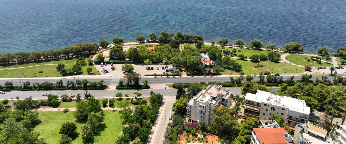A coastal town with a marina, green parks, and residential buildings.