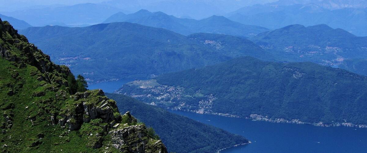 A mountainous landscape with a lake and a town.