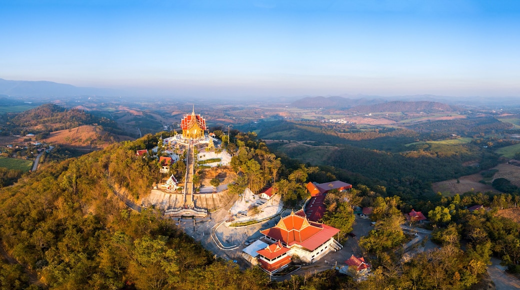 Top view Aerial photo from flying drone.The beautiful of Thai temple (Wat Pa Phu Hai Long) on the top of mountain in Pak Chong District,Nakorn Ratchasima, Thailand.