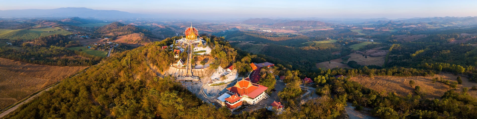 Top view Aerial photo from flying drone.The beautiful of Thai temple (Wat Pa Phu Hai Long) on the top of mountain in Pak Chong District,Nakorn Ratchasima, Thailand.