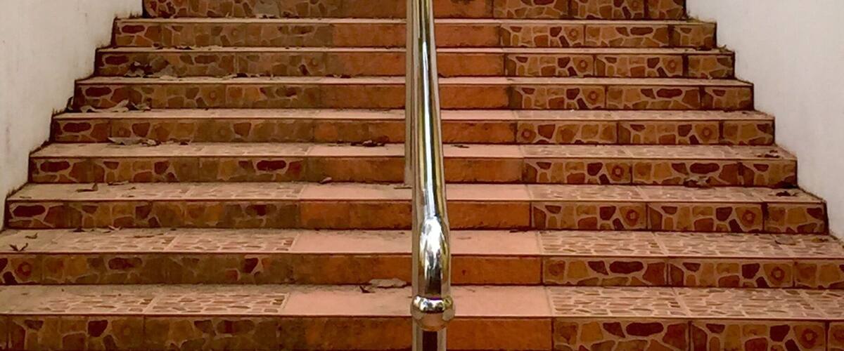 Staircase to the temple entrance of Wat Phrathat Doi Kham. It was a holiday and a Saturday, so there was a steady stream of people flowing up and down. I felt lucky to get this shot of them relatively empty.
At the top, the view of Chiang Mai below is spectacular!