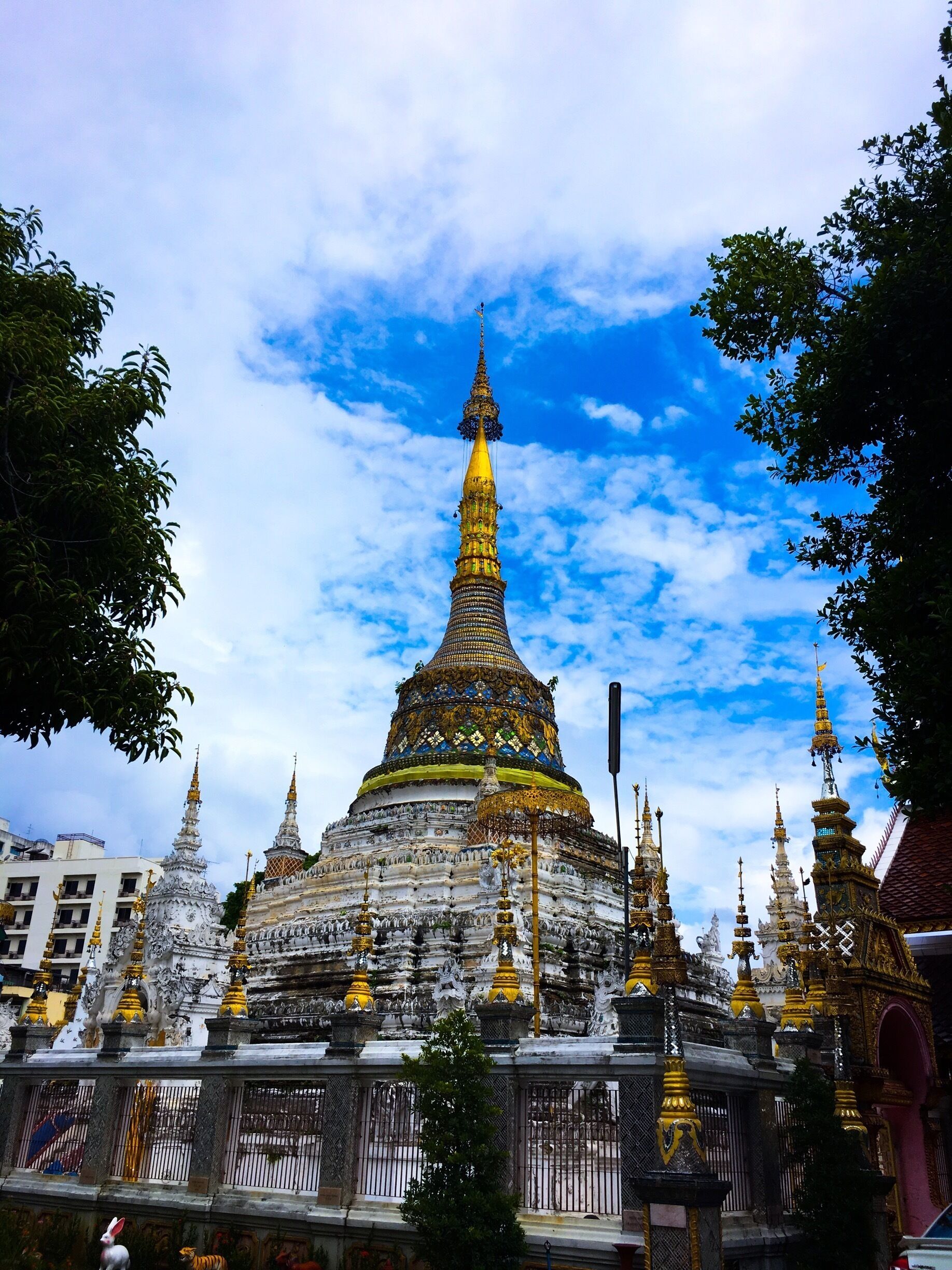 A temple with a golden spire and intricate carvings.