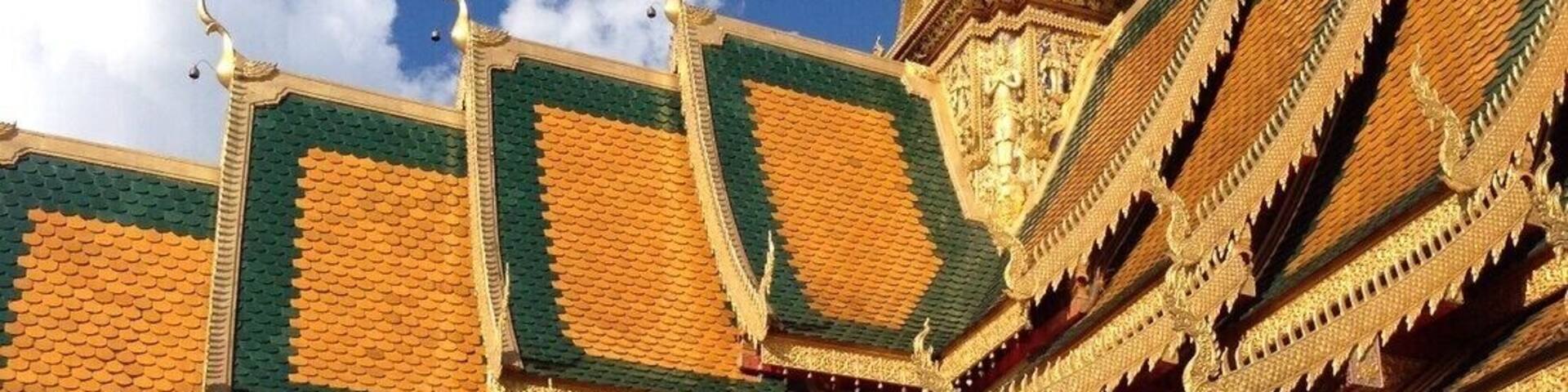 A temple with ornate golden roofs and intricate carvings.