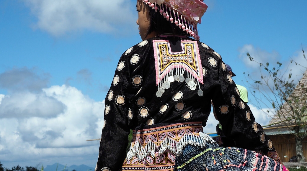 just outside of the city of Chiang Mai you can find Mae Rim district where altitude rises rapidly and nature will stun you with its beauty. A little further is the mountaintop of Mon Jam with stunning views of the surrounding mountains and valley. People who live here are mostly from the Hmong hill tribe, the children often displaying their beautiful traditional garments.