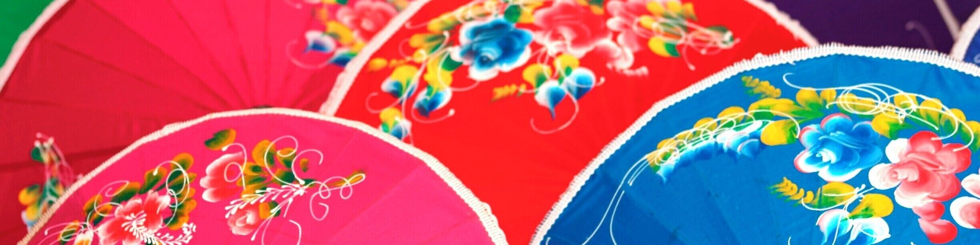 A collection of colorful umbrellas with floral designs.