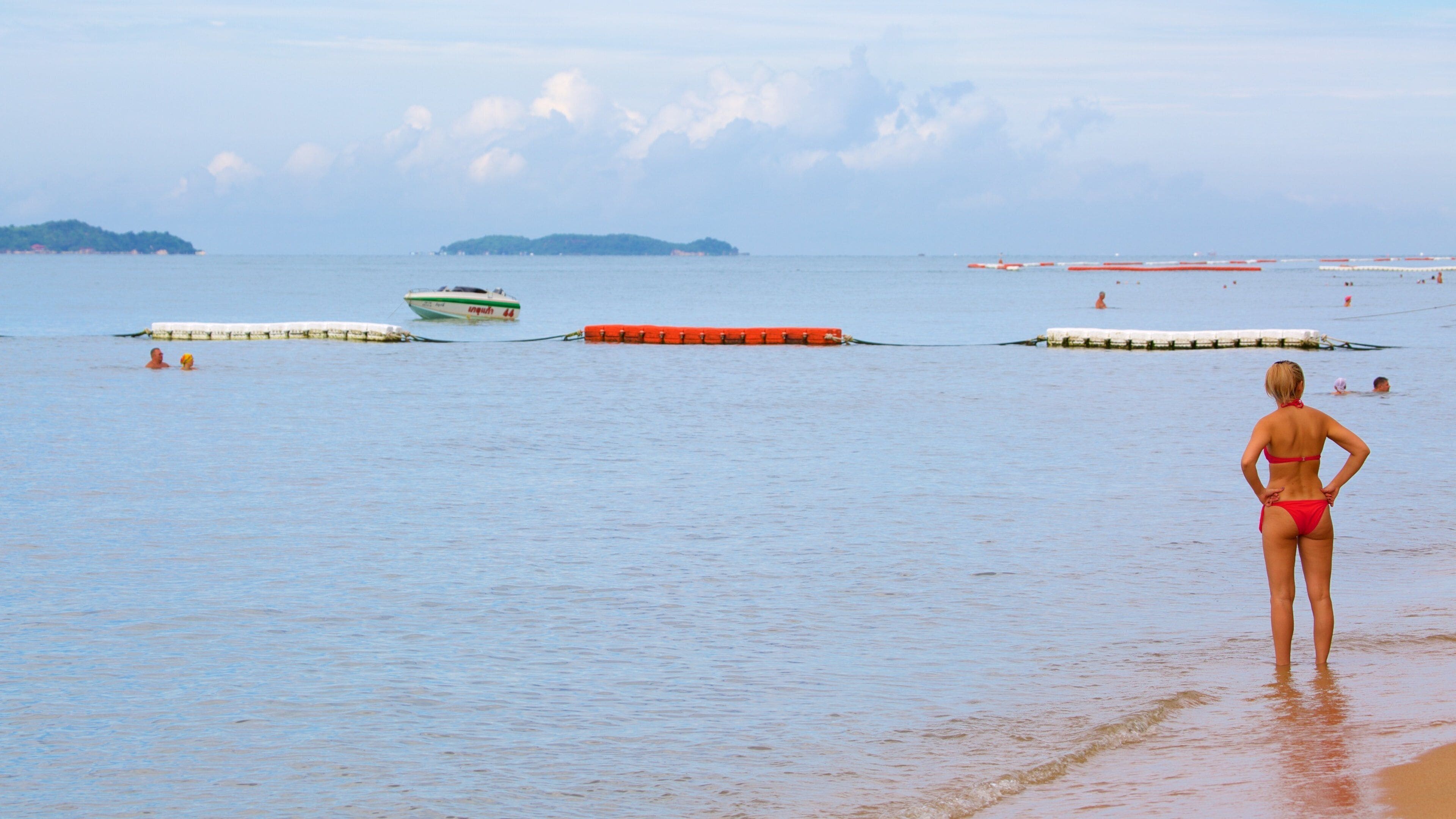 Jomtien Beach which includes general coastal views as well as an individual femail