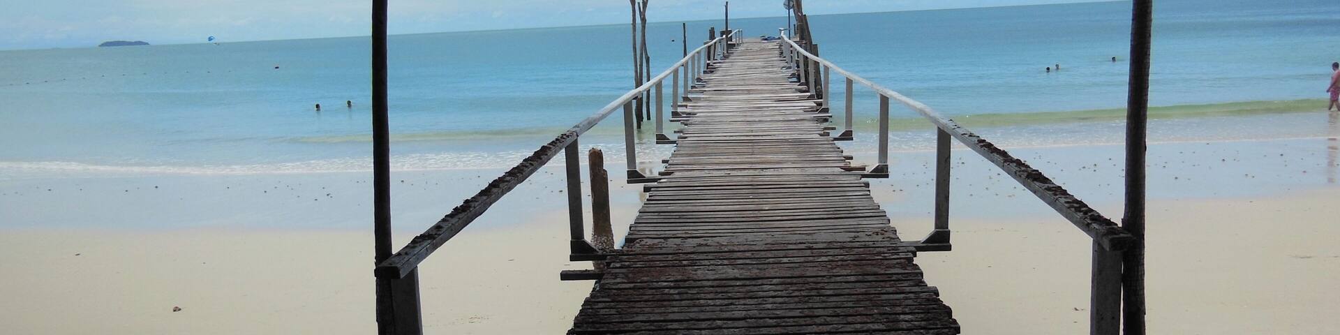The white sand beaches with this rickety dock that seem to go out to unknown adventures ahead of me.
