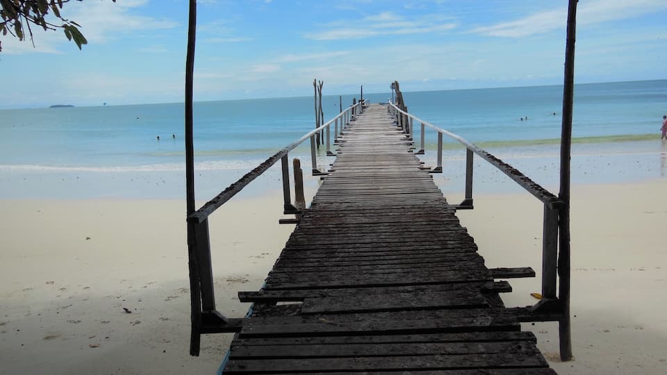 The white sand beaches with this rickety dock that seem to go out to unknown adventures ahead of me.
