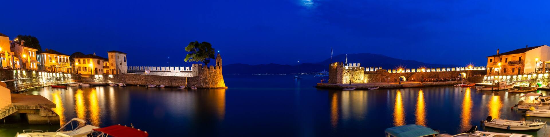 Panorama of famous port in Nafpaktos in Greece during blue hour.