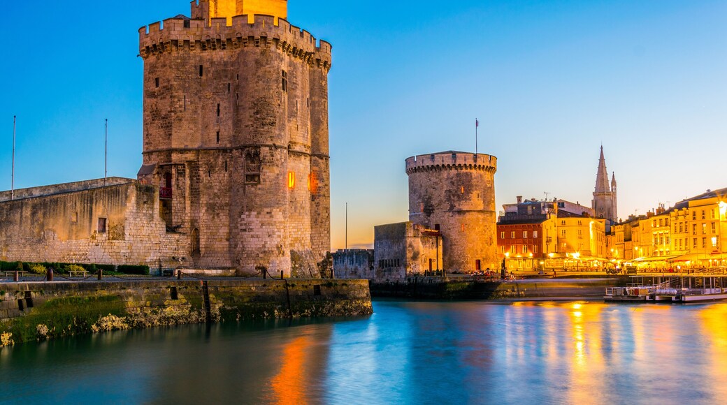 Sunset view of Port of La rochelle guarded by tour de la chaine and tour Saint Nicholas, France