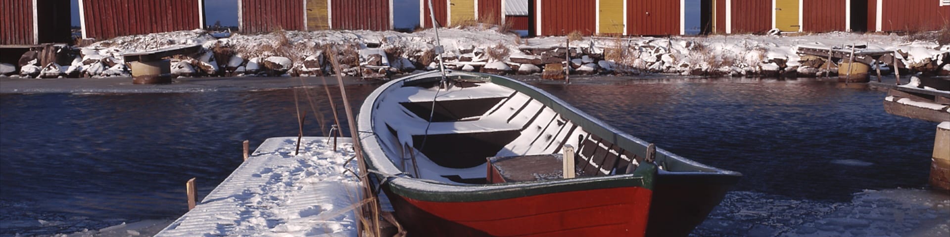 Vaasa showing boating, snow and a bay or harbour