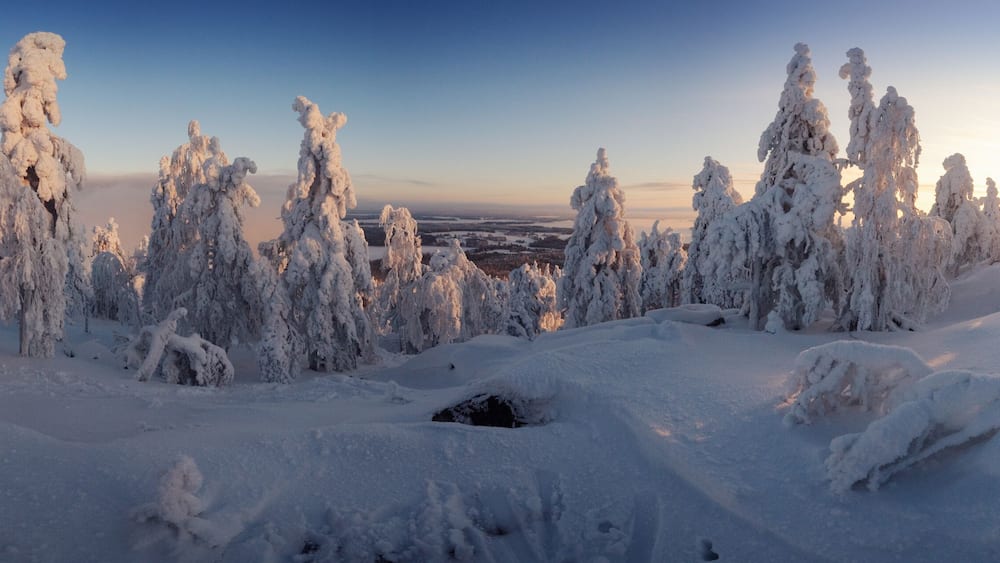 Panorama landscape covered with snow in a ski resort at sunrise. Vuokatti Finland