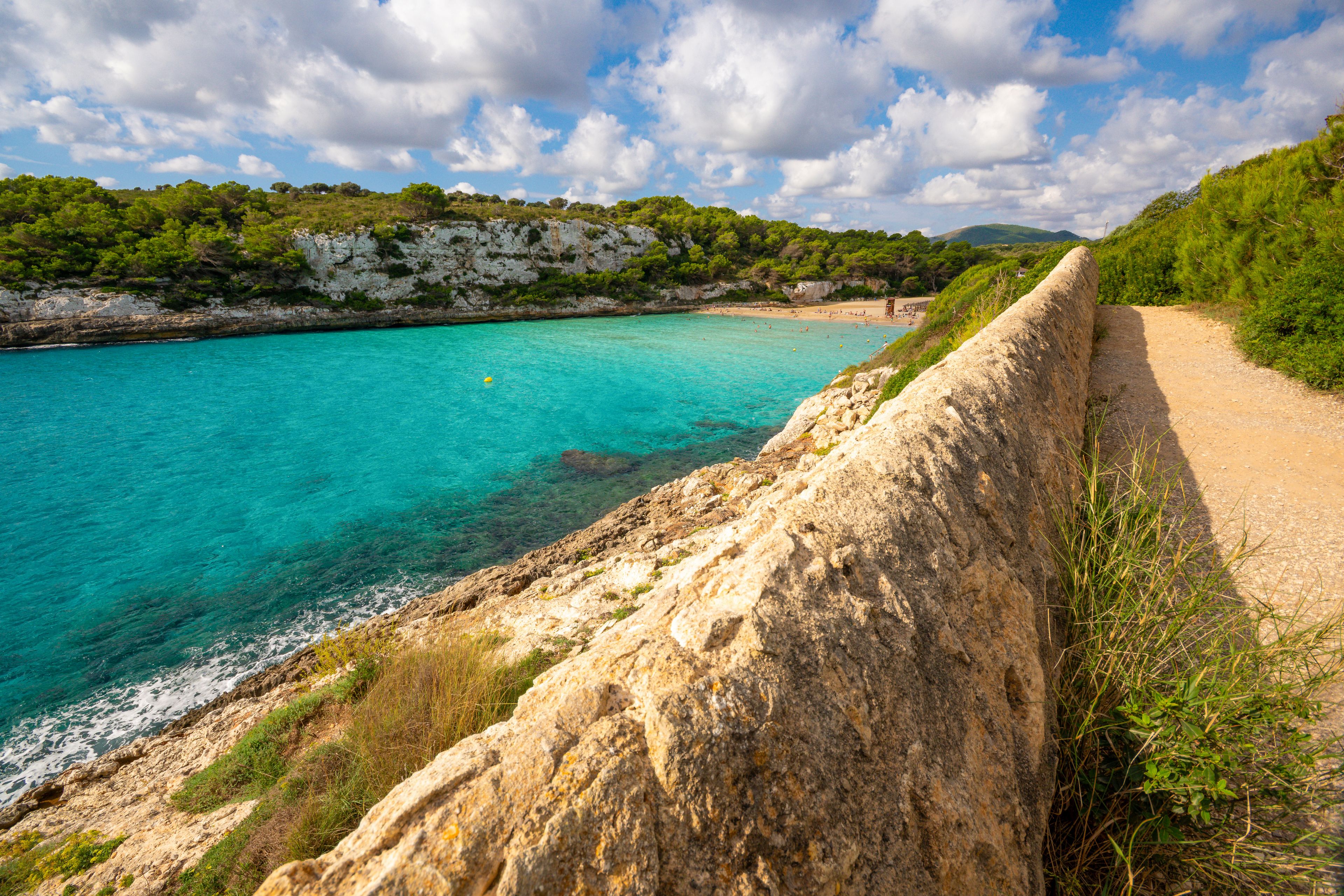 Panoramic view of Cala Romantica bay with turquoise water, rocky coastline Mallorca, Spain