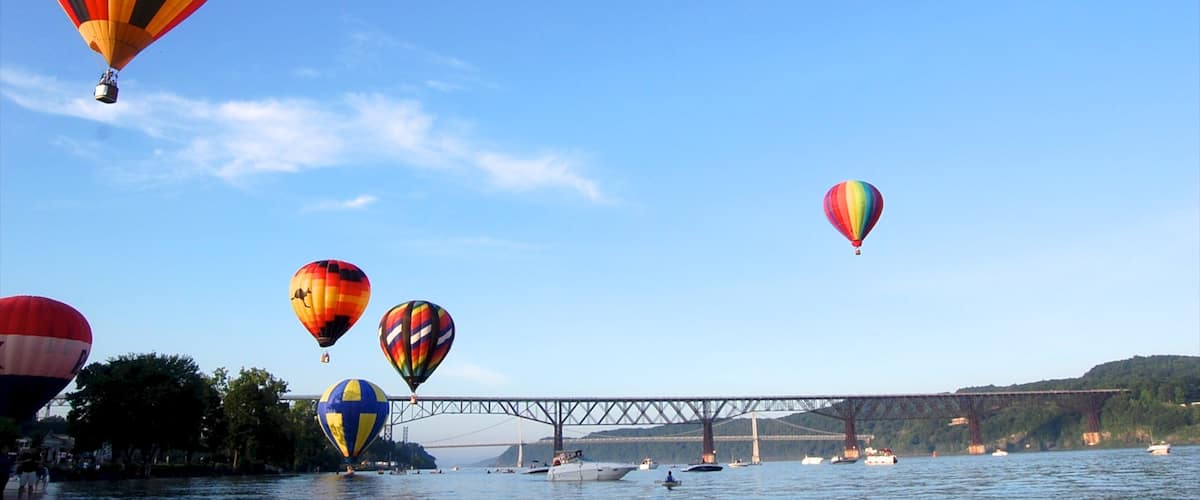 Poughkeepsie showing a river or creek, a bridge and ballooning