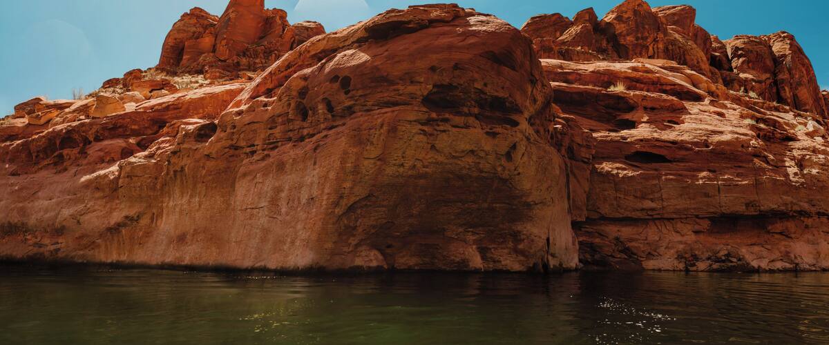 Nothing says adventure like facing your fears head on with an adventure buddy. I had already made the jump, and this is my friend, Brooke, taking the leap while I floated on a kayak below. It takes an adventurous spirit to see the stomach-dropping fear in front of you, and take the leap to overcome it.
Lake Powell is a great spot to find epic rock climbing and cliff jumping. Those who manage to complete the epic climb are rewarded with the thrill of an epic jump! But it is important to always take every precaution, and always check the depth of the water prior to jumping. We found this cliff a swim away from our campsite at Lake Powell. #adventure #cliffjumping