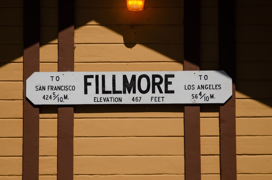 A sign indicating directions to Fillmore, with distances to San Francisco and Los Angeles, and the elevation of Fillmore.