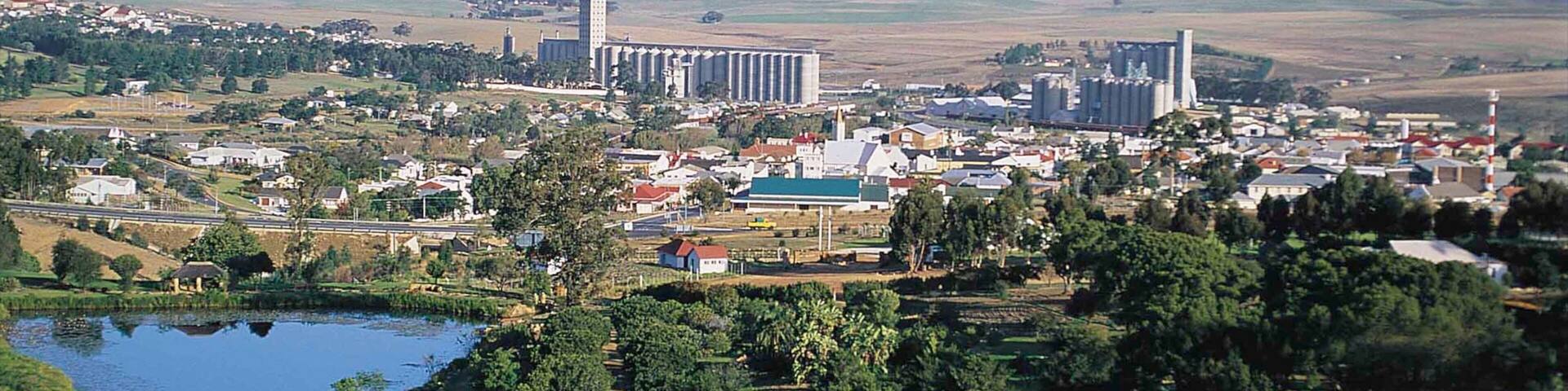 Caledon featuring a small town or village, a pond and a park
