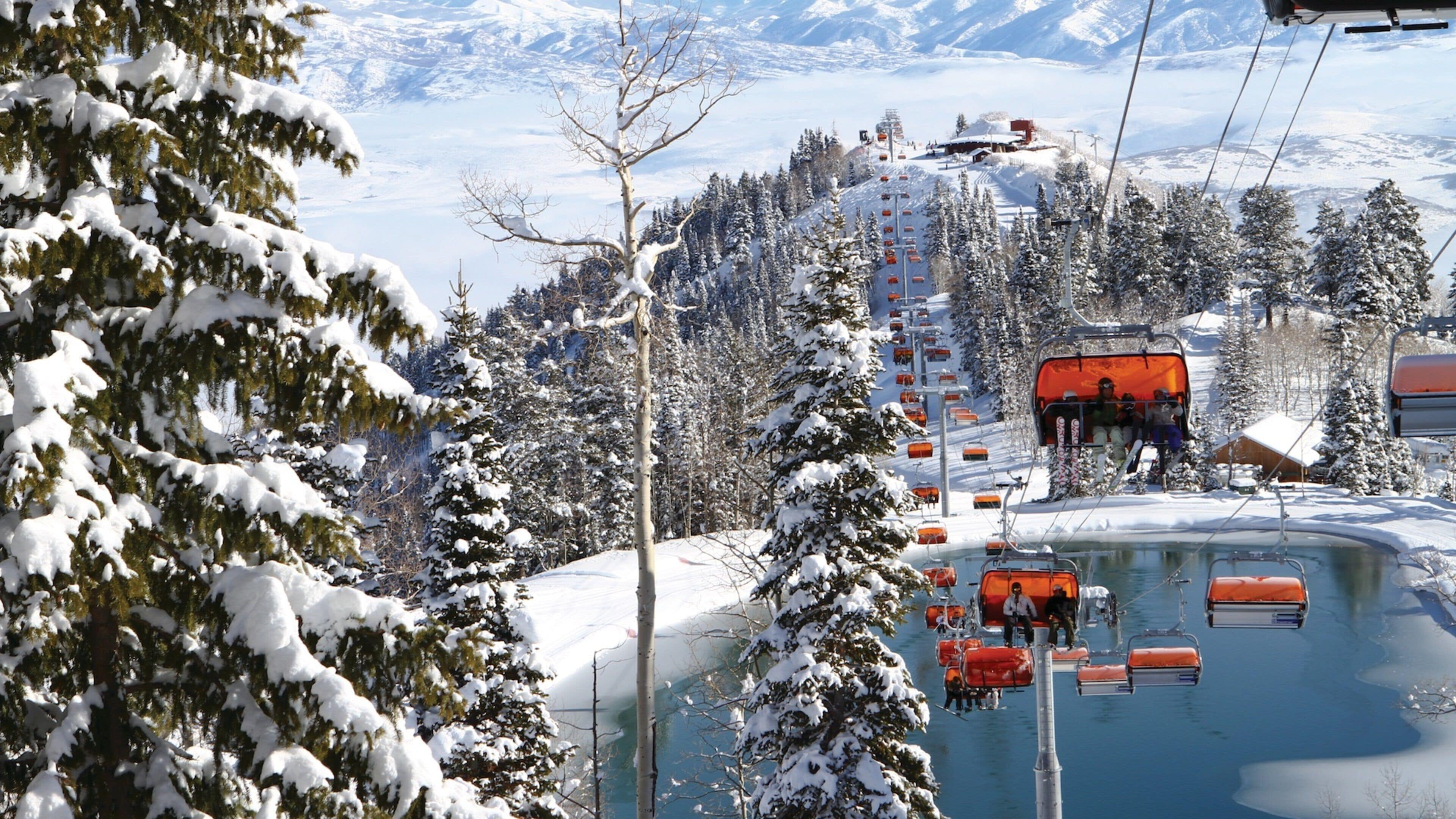 Canyons Resort featuring snow, a gondola and a pond