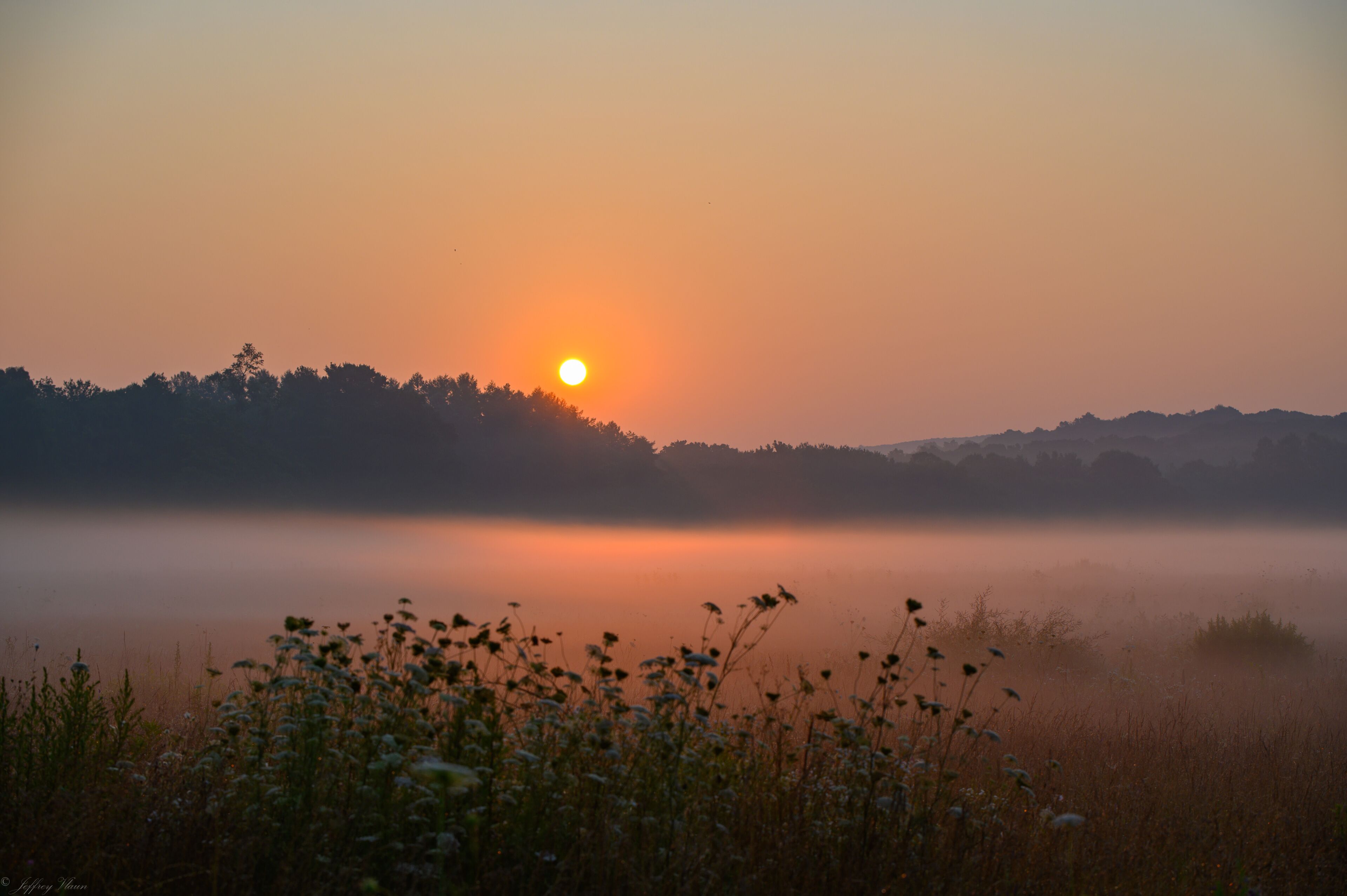 Sunrise over a fog-covered field in Preston, Connecticut.