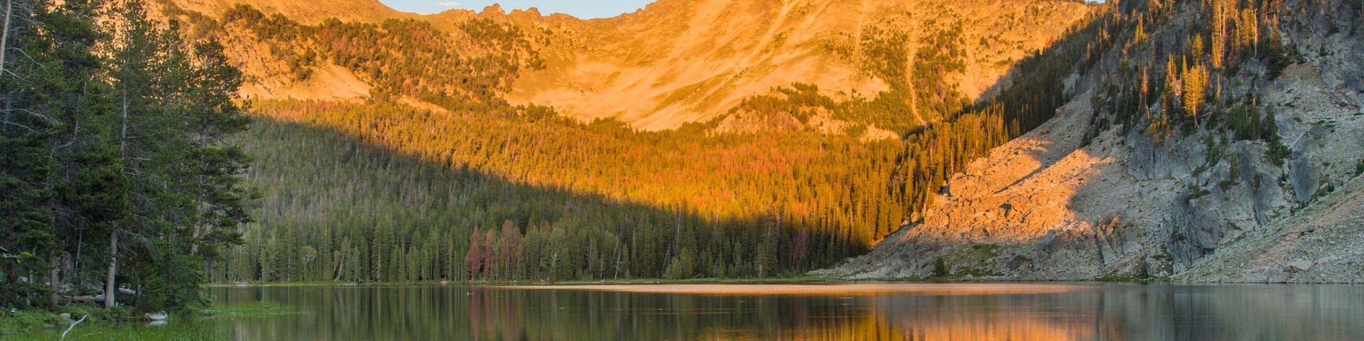 Southwest Montana showing a sunset, forest scenes and a lake or waterhole