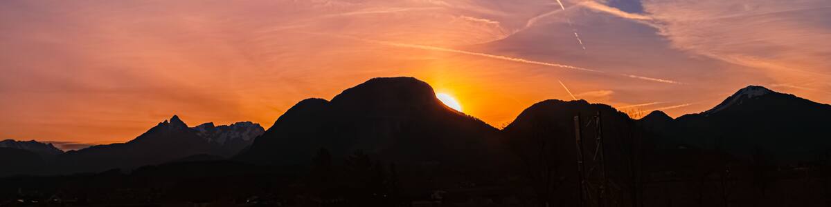 Alpine sunrise with mountain silhouettes near Kiefersfelden, Rosenheim, Bavaria, Germany