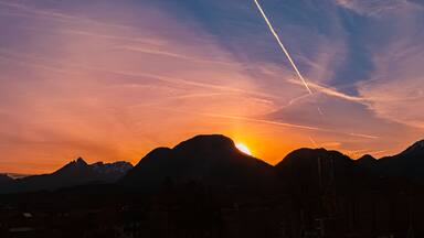 Alpine sunrise with mountain silhouettes near Kiefersfelden, Rosenheim, Bavaria, Germany