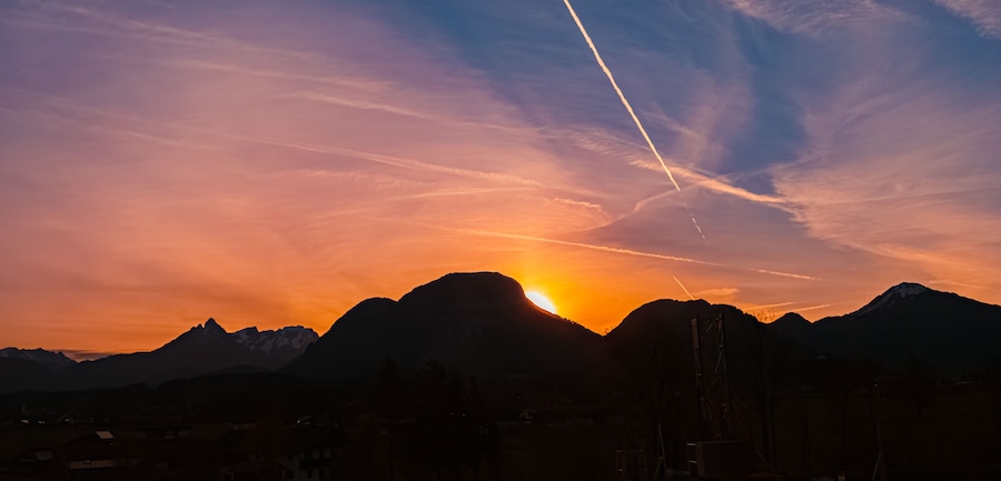 Alpine sunrise with mountain silhouettes near Kiefersfelden, Rosenheim, Bavaria, Germany