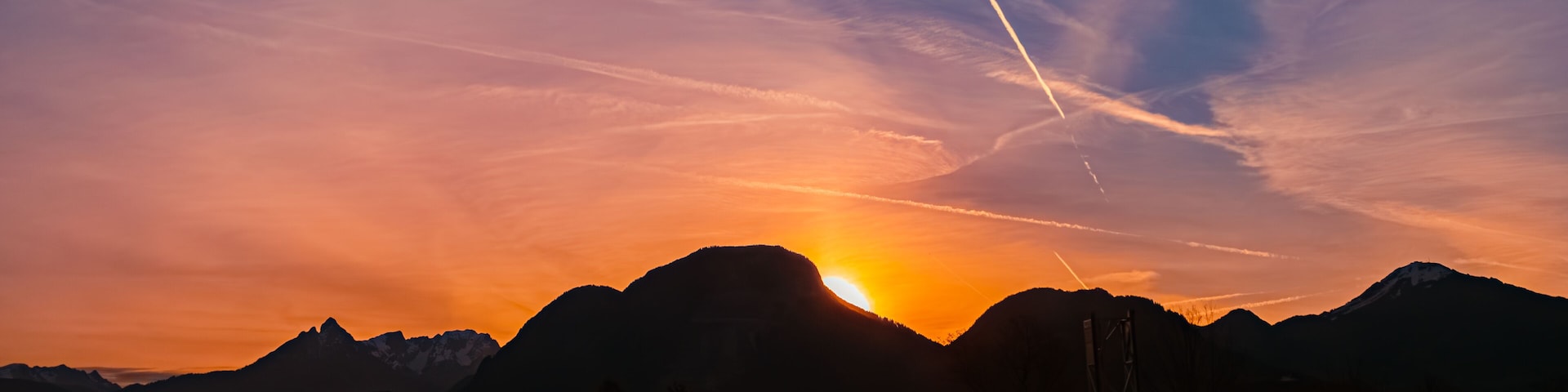 Alpine sunrise with mountain silhouettes near Kiefersfelden, Rosenheim, Bavaria, Germany