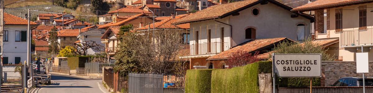 Costigliole Saluzzo, Cuneo, Italy: A landscape view of the historical village of Costigliole Saluzzo with the Red Castle and the Reynaudi Castle on the hill