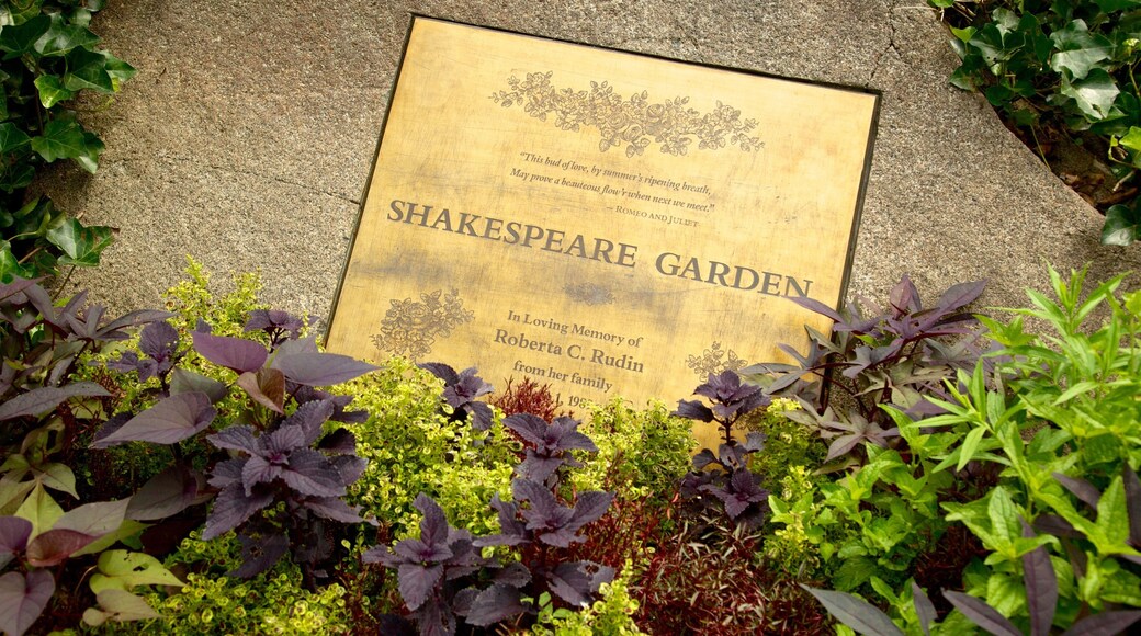 Central Park showing signage and a garden