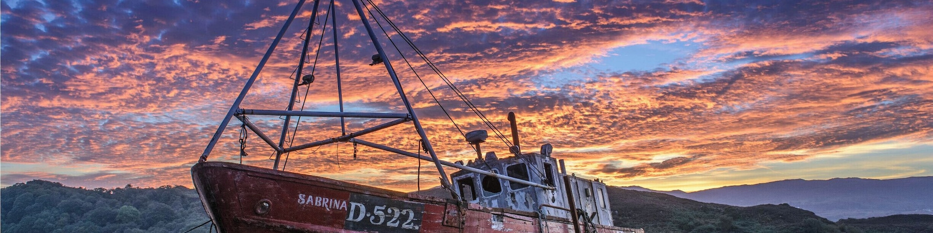 A wrecked fishing boat "Sabrina" in its final resting place on the banks of Mulroy Bay in County Donegal, Ireland. #BVStrove #Golden