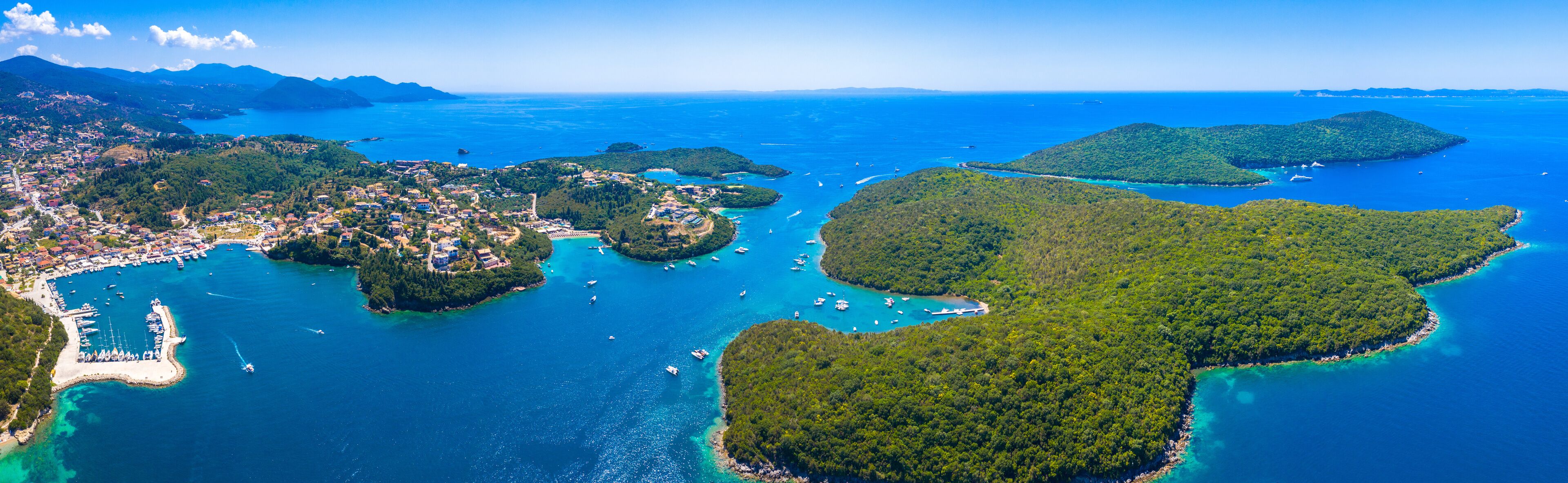 Aerial view of iconic paradise sandy beaches with turquoise sea in complex islands of Agios Nikolaos and Mourtos in Sivota area, Epirus, Greece