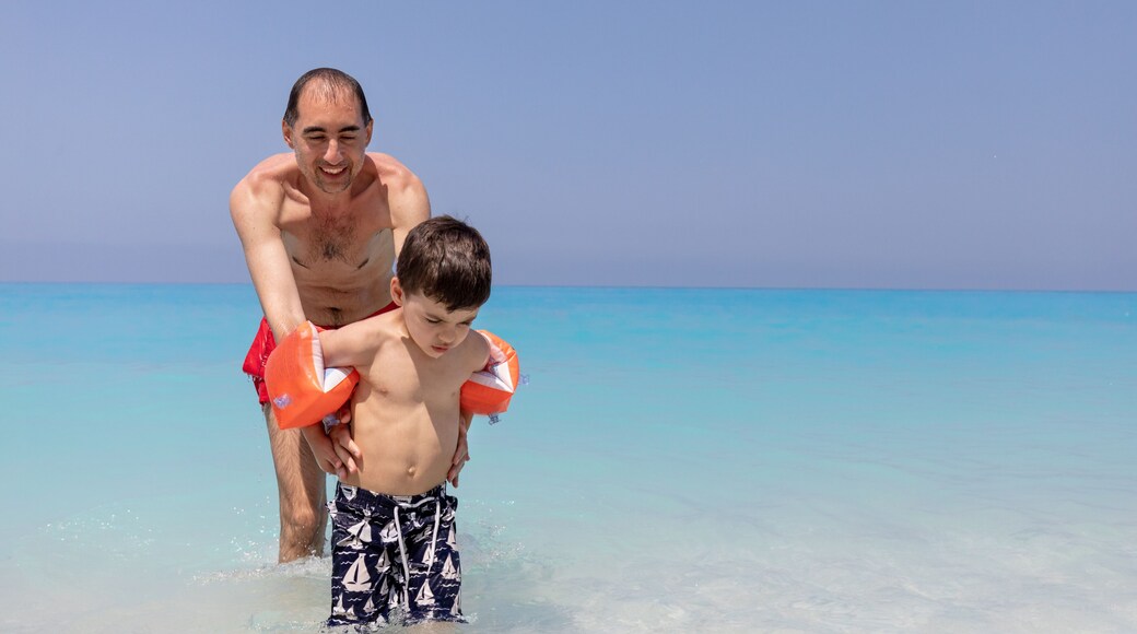 Father and son at Ionian Sea, Egremni beach, Lefkada Greece