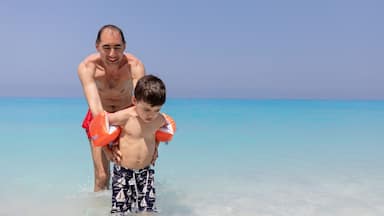 Father and son at Ionian Sea, Egremni beach, Lefkada Greece