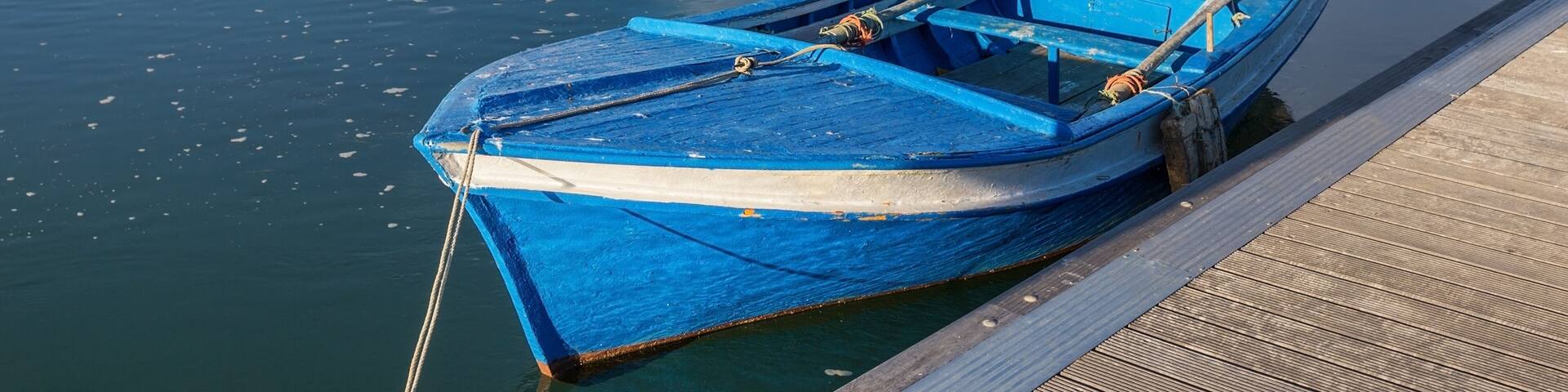 Traditional Portuguese boat at the dock. View Cabanas de Tavira.