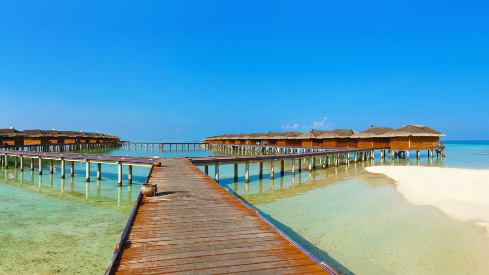 Bungalows on tropical Maldives island