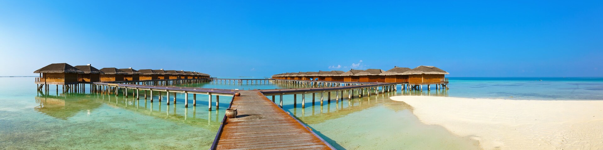 Bungalows on tropical Maldives island