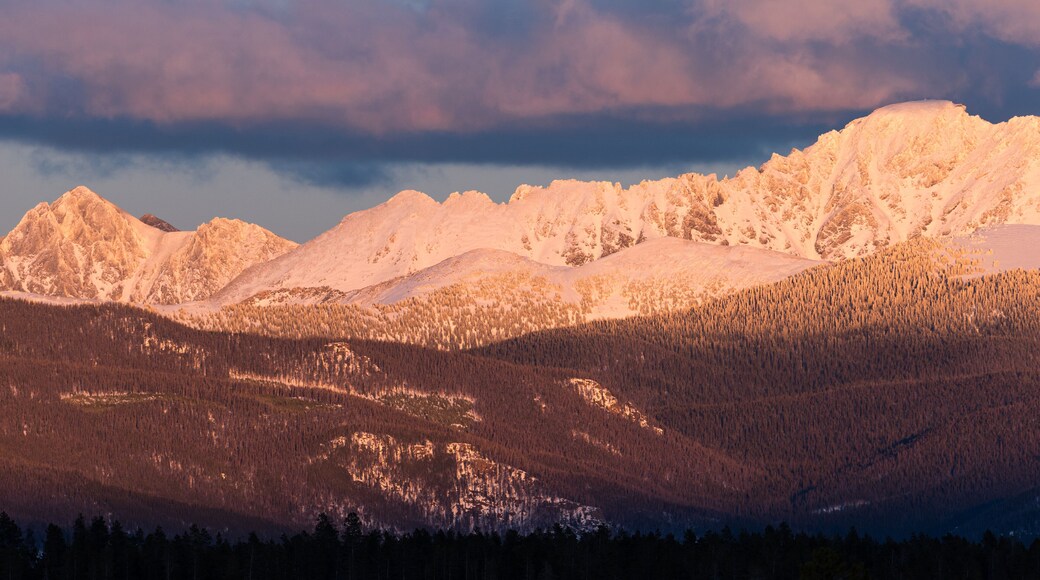 View of Indian Peaks from Fraser Valley Colorado. The west side of the Indian Peaks at sundown viewed from the Fraser Valley. The towns of Tabernash and Fraser are below the Indian Peaks.