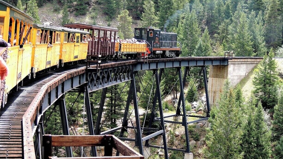 Georgetown's Historic Loop Railroad navigates the first of two hairpin curves designed to tackle the unprecedented 6% grade of Clear Creek Valley in the Front Range of Colorado's Rocky Mountains. Hauling silver down from the mines in Leadville 35 miles southwest of Georgetown was the driving force behind this stretch of track back in 1884. Today, it's all a piece of the past, one that comes with considerable sentiment for train enthusiasts like my husband. Read more about our ride via my blog at http://www.aplacecalledroam.com/home/boom-is-back-on-georgetowns-historic-rail-line.