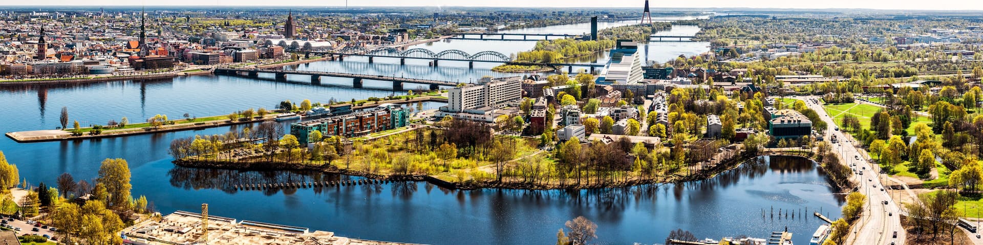A river with bridges, a cityscape, and a prominent tower.