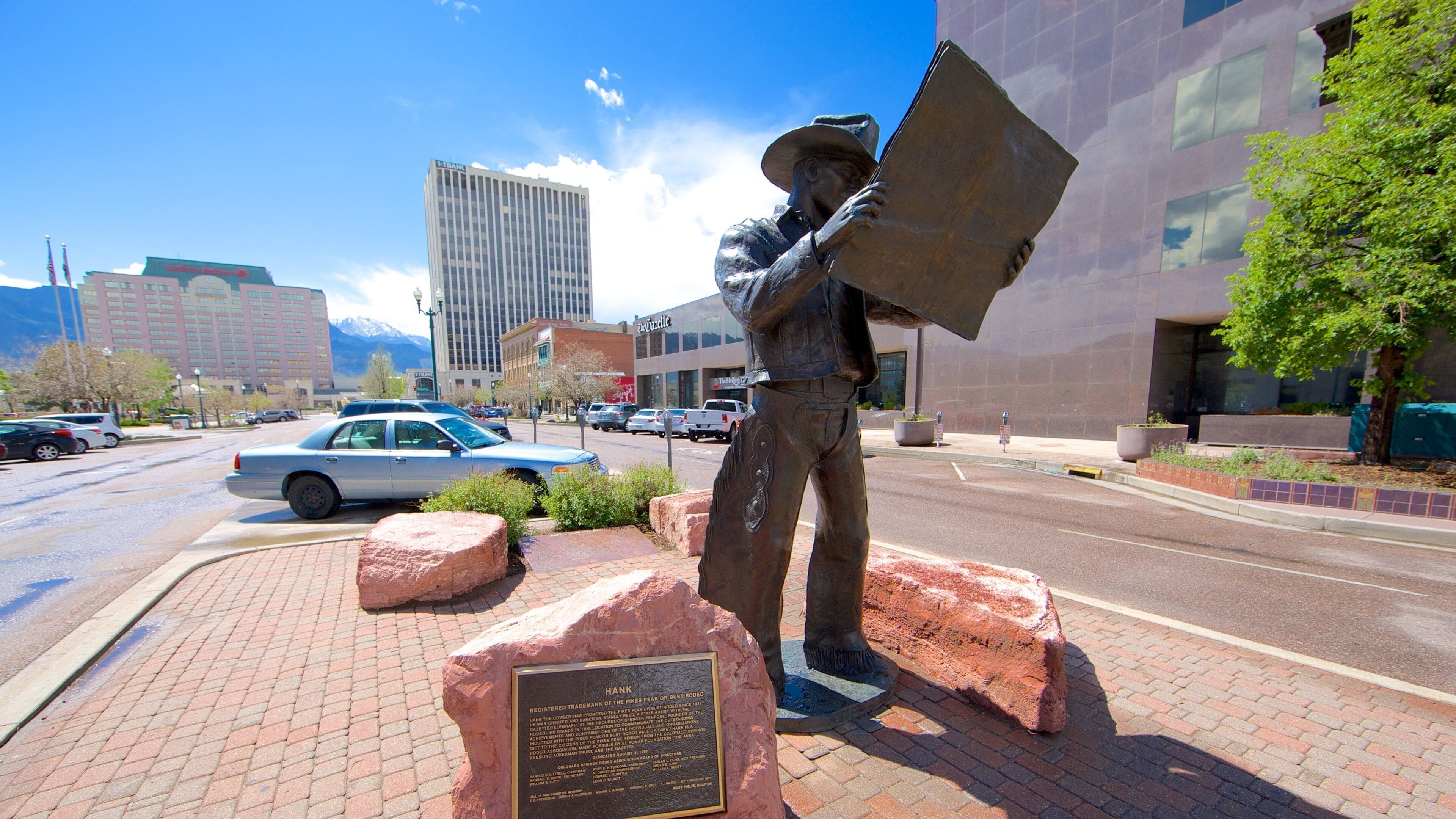 Downtown Colorado Springs which includes street scenes and a statue or sculpture