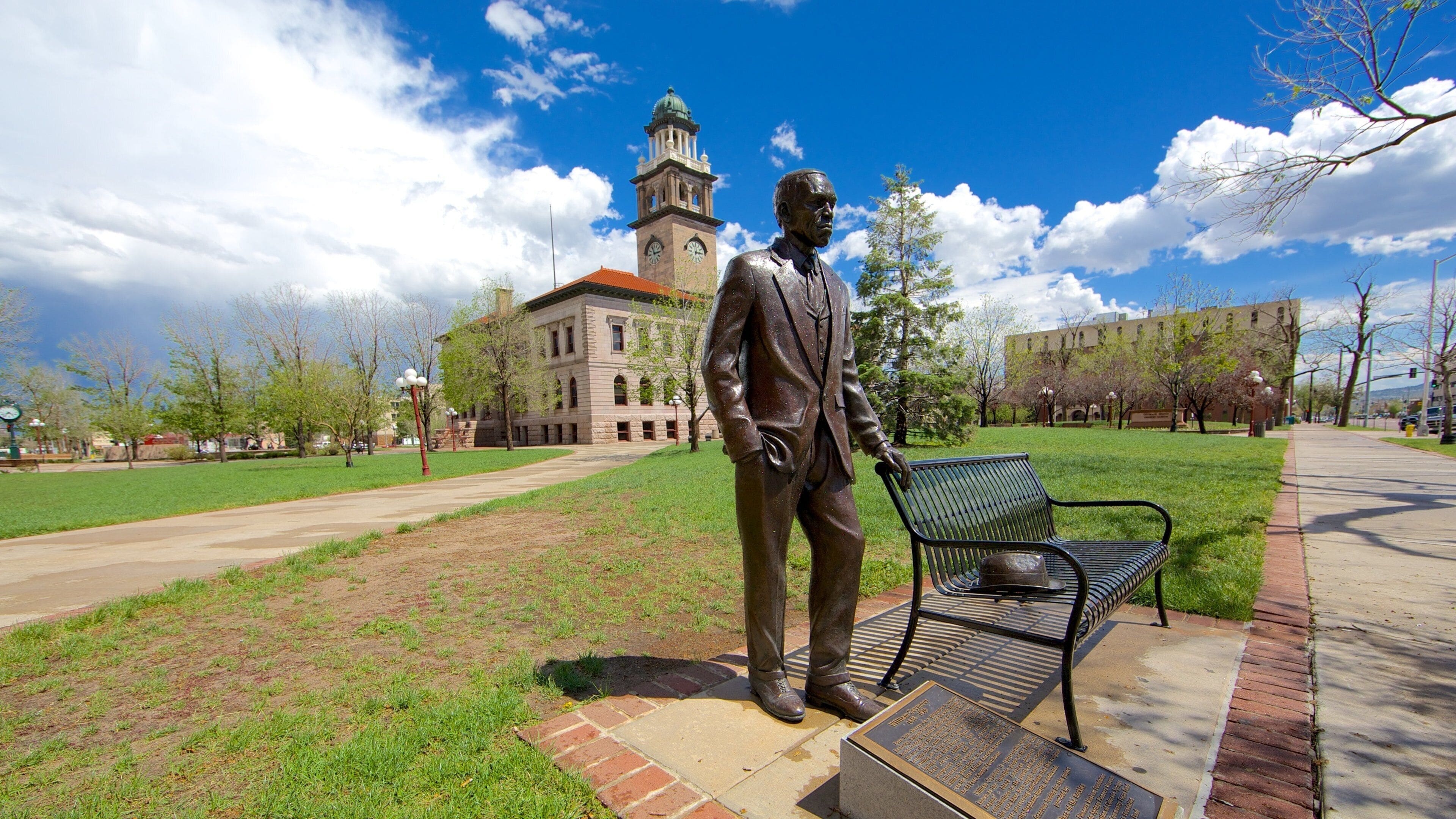 Downtown Colorado Springs featuring a statue or sculpture and a garden